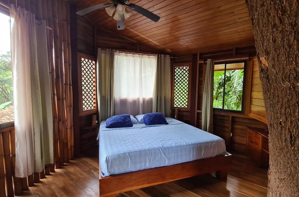 Bedroom from the wooden bungalow at Wild Life Lodge, rental income property, Hotels and businesses for Sale at Samara Beach, Costa Rica