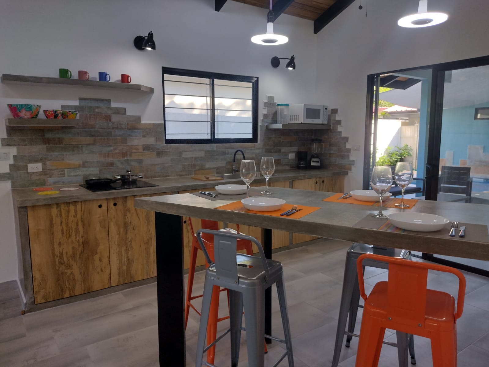 modern kitchen with breakfast bar in Casa espinoza home for sale samara costa rica