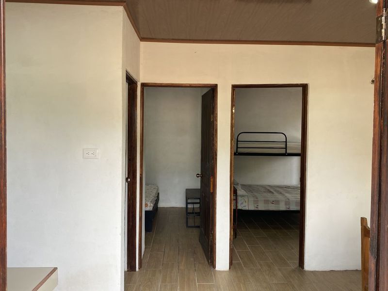 open doors showing bedrooms in Casa Munoz home for sale samara costa rica
