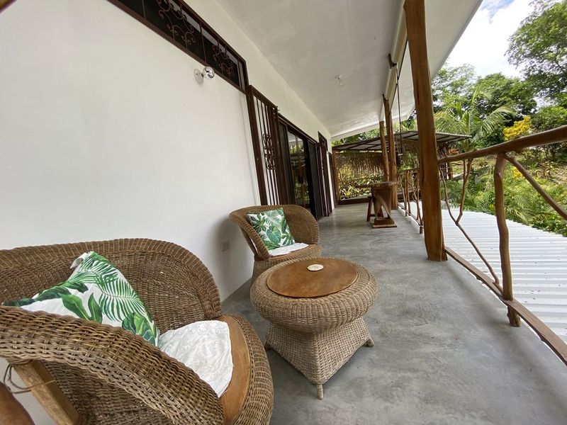 balcony with relaxing chairs at the holistic yoga retreat hotel for sale samara guanacaste costa rica