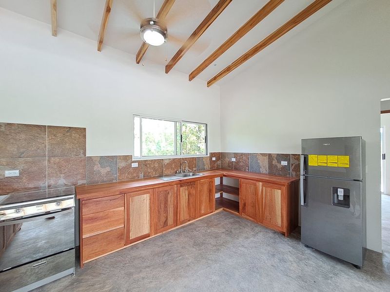 large equipped kitchen in Casa colina mono home for sale samara costa rica