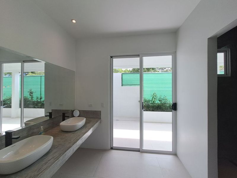 Double sink modern bathroom at Casa Mar y sol home for sale samara guanacaste costa rica