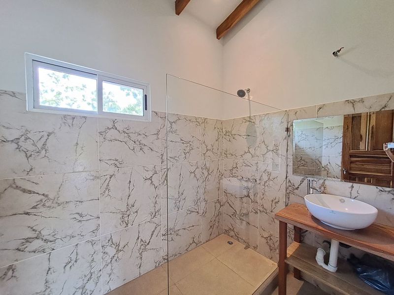 shower with glass door in Casa colina mono home for sale samara costa rica