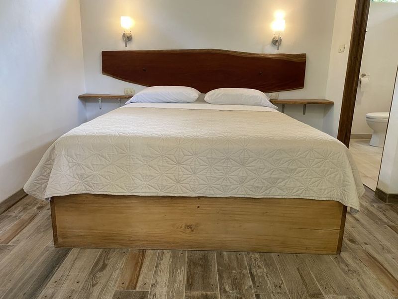 wooden double bed in the holistic yoga retreat hotel for sale samara guanacaste costa rica