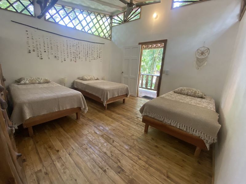 3 beds in the bedroom of the holistic yoga retreat hotel for sale samara guanacaste costa rica