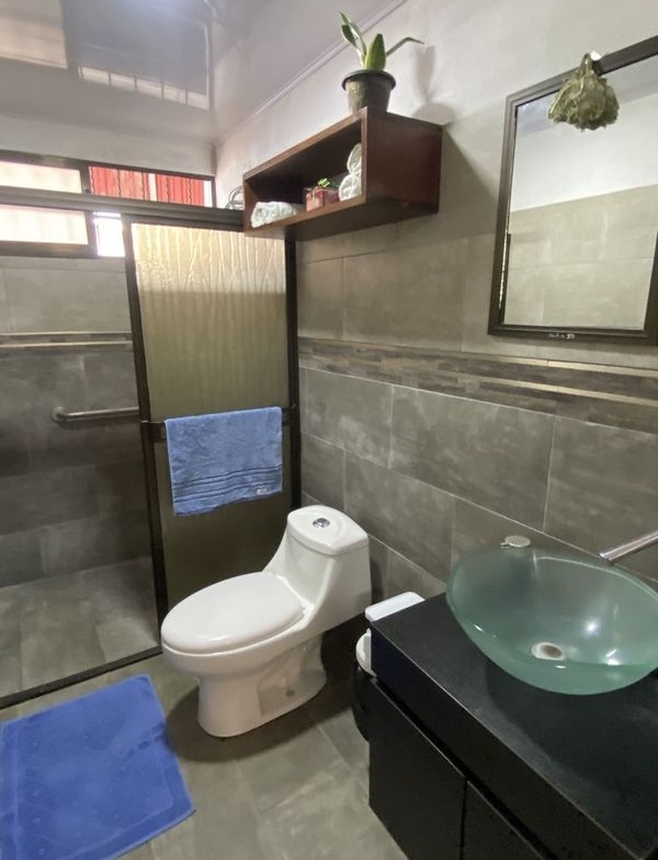toilet and sink in bathroom of Casa Munoz home for sale samara costa rica