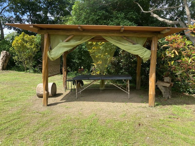 Covered deck with massage table at the holistic yoga retreat hotel for sale samara guanacaste costa rica