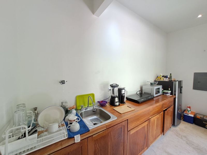 equipped kitchen of Casa colina mono home for sale samara costa rica