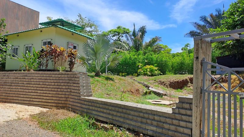 Concrete fence and gate of Casa Pequeña home for sale samara costa rica
