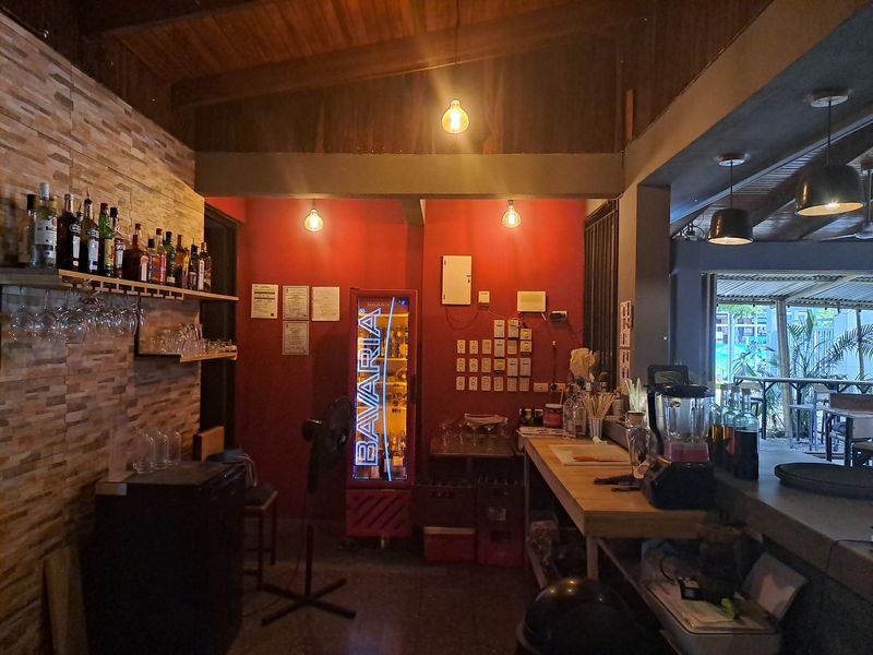 Bar with bottles and fride of restaurant Porque Si business for sale Samara costa rica