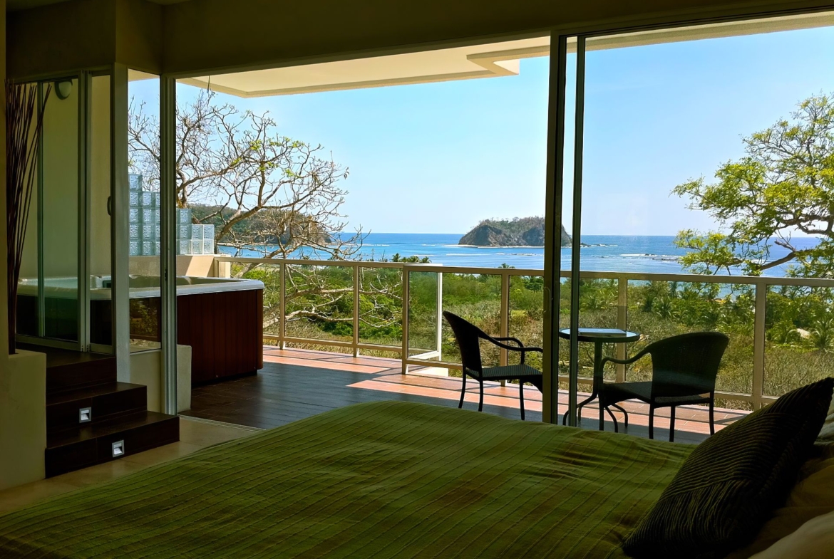 Green bed with balcony ocean view Samara Reef Condos luxury real estate for sale samara Guanacaste Costa Rica