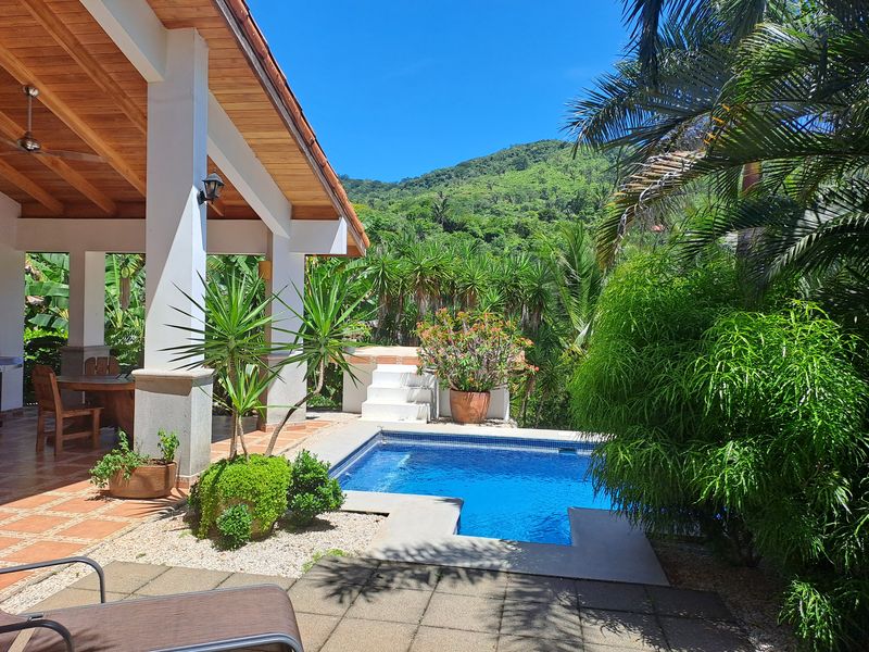 Tropical garden with pool at Casa Vista Las Palmas home for sale samara guanacaste costa rica