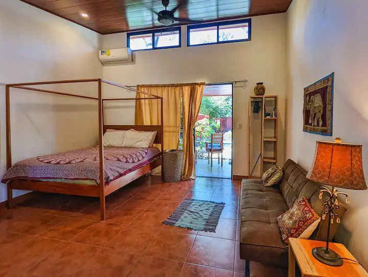 lovely Bedroom with canopy bed and sofa at Casa Fiona home for sale Samara Guanacaste Costa Rica