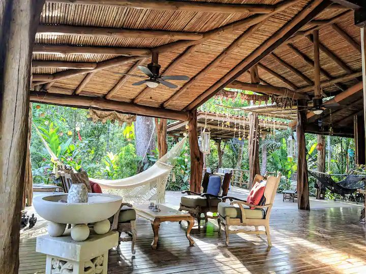Tropicla covered deck with hammocks at Casa KUPU KUPU luxury home for sale samara Guanacaste Costa Rica