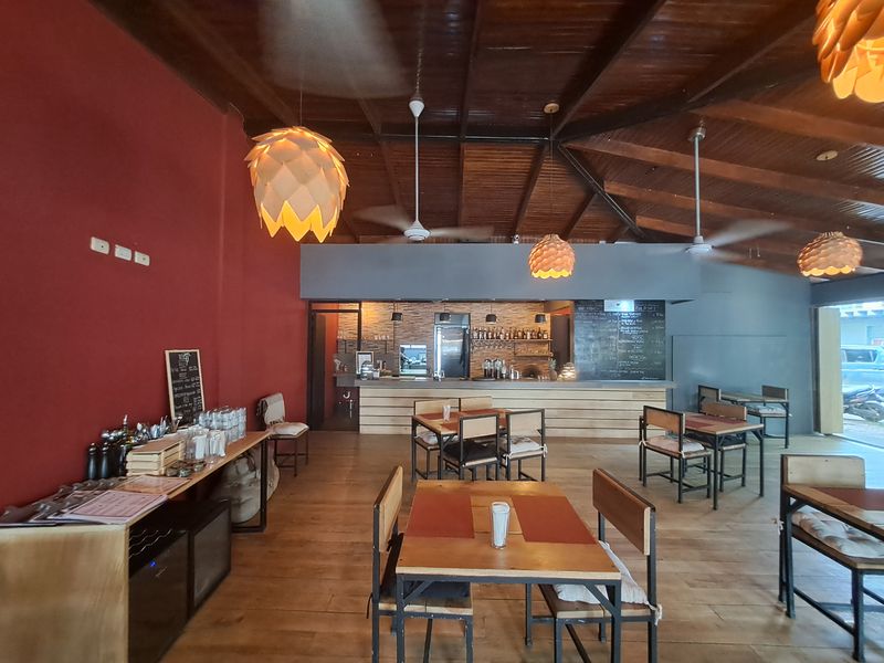 four tables with chairs and bar restaurant Porque Si business for sale Samara costa rica