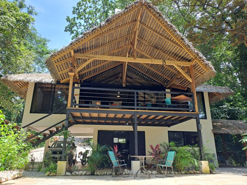 tropical front view of Casa Jungle Oasis home for sale Samara Woods Samara Costa Rica