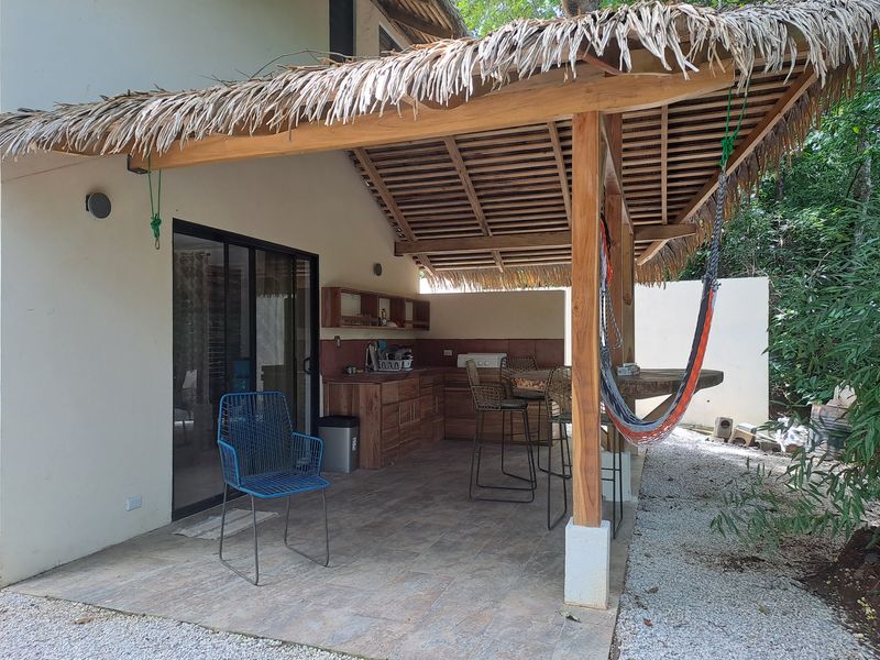 outdoor terrace with kicthen at Casa Jungle Oasis home for sale Samara Woods Samara Costa Rica