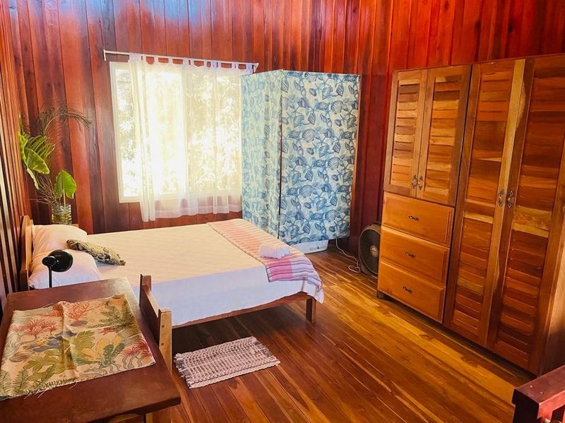 bedroom with wooden armory and floors at Casa Surfside home for sale Samara Guanacaste Costa Rica