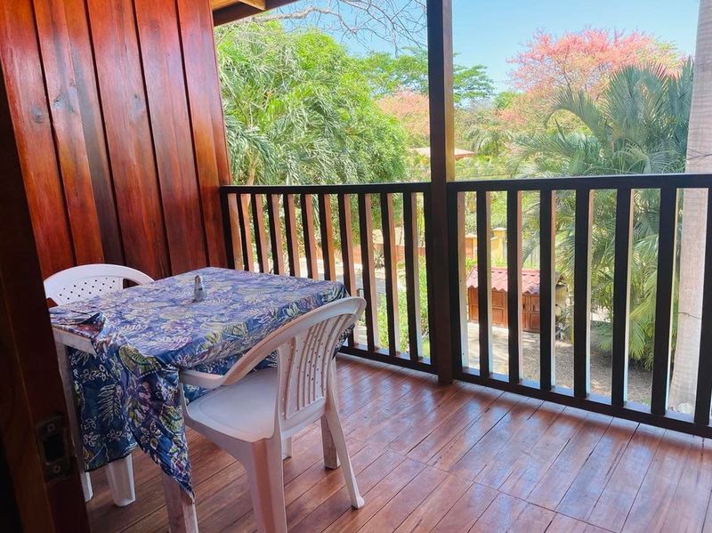 balcony with table and chairs at Casa Surfside home for sale Samara Guanacaste Costa Rica